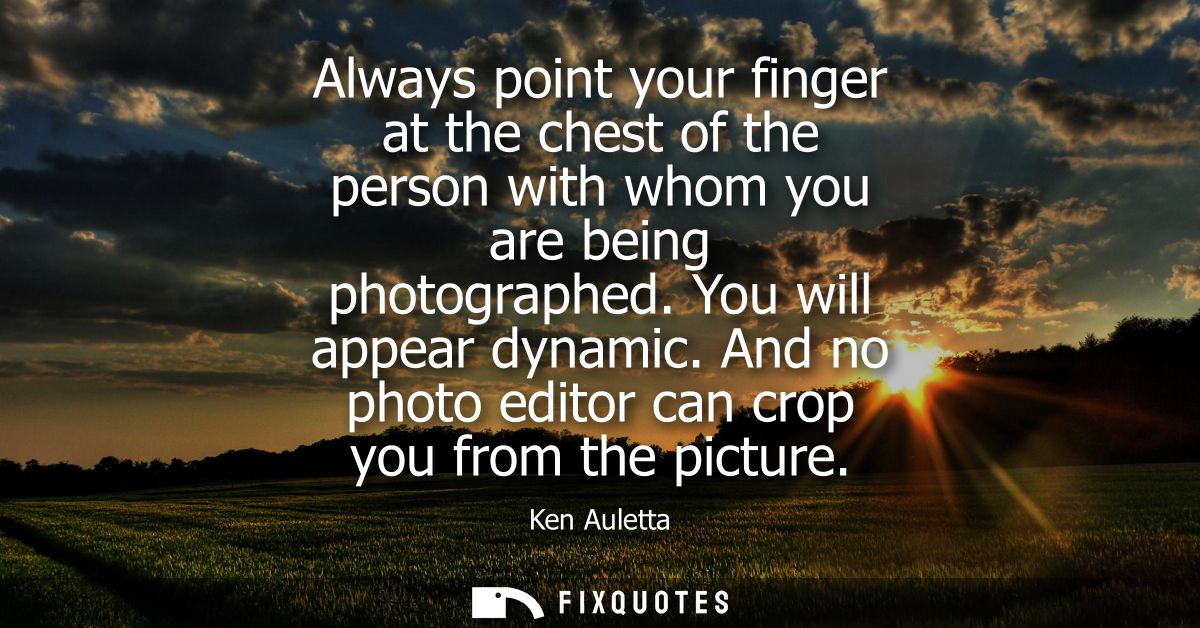 Always point your finger at the chest of the person with whom you are being photographed. You will appear dynamic.
